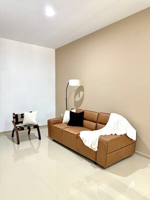 Deluxe Double Room | Living room | 65-inch LED TV with cable channels