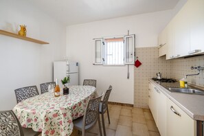 Fridge, dishwasher, coffee/tea maker, cookware/dishes/utensils