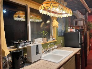 Fridge, microwave, stovetop, coffee/tea maker