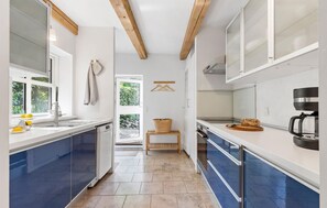 Fridge, stovetop, dishwasher, coffee/tea maker