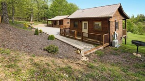 A wooden cabin with a porch, a small deck, and a mailbox. - Cabin #3 The Sky Retreat - Off the Blue Ridge Parkway (Purlear)