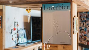 A framed poster with the text "Loverbier" and a silhouette of a couple.