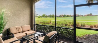 Enjoy views of the immaculate green from your screened lanai at Lakeside National - Golfside Escape