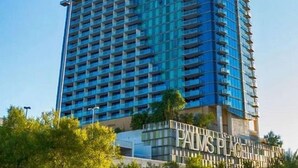 A high-rise building with a modern architectural design, featuring a prominent glass facade and a sign at the base reading "PALMS PLACE". - Strip View Studio • Balcony • No Resort Fee • Free Parking • TH27 (Las Vegas)