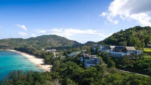 A coastal area with a beach, houses, and lush greenery. - Experience the Ultimate Holiday while staying in this Luxury Villa in Phuket, Phuket Villa 1062 (Phuket)
