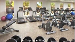 A gym with treadmills, elliptical machines, and free weights. - Coachell - Marriott Shadow Ridge (Palm Desert)