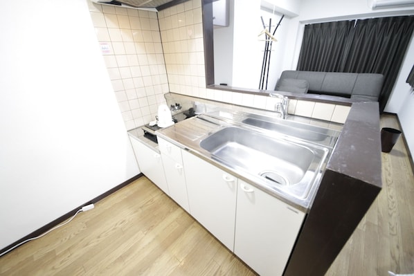 Mini-fridge, microwave, cookware/dishes/utensils