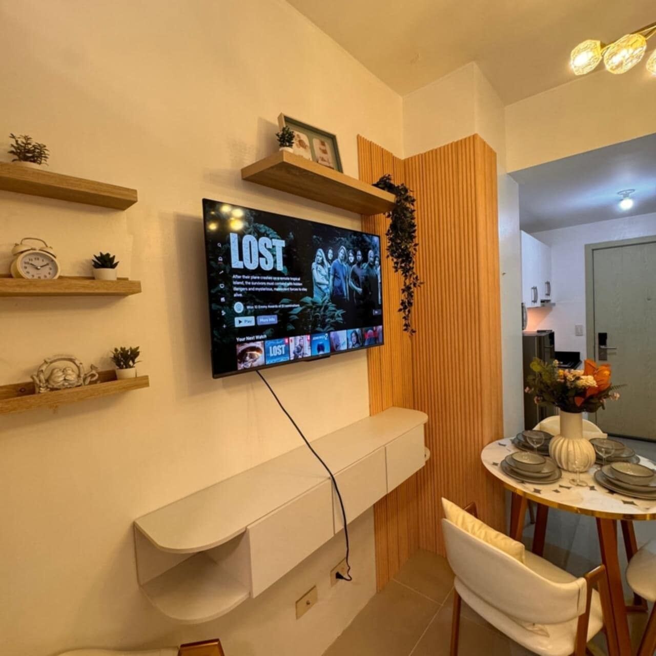 Deluxe Condo, 1 Bedroom, Balcony, Pool View | Living area | 42-inch Smart TV with digital channels, Netflix, streaming services