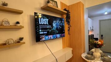 Deluxe Condo, 1 Bedroom, Balcony, Pool View | Living area | 42-inch Smart TV with digital channels, Netflix, streaming services