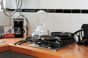 Fridge, microwave, stovetop, coffee/tea maker