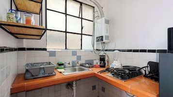 Fridge, microwave, stovetop, coffee/tea maker