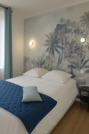 A bedroom with a bed, a blue throw blanket, and a wall mural of palm trees.