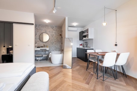 Luxury Suite, Garden View | In-room safe, laptop workspace, iron/ironing board, free WiFi