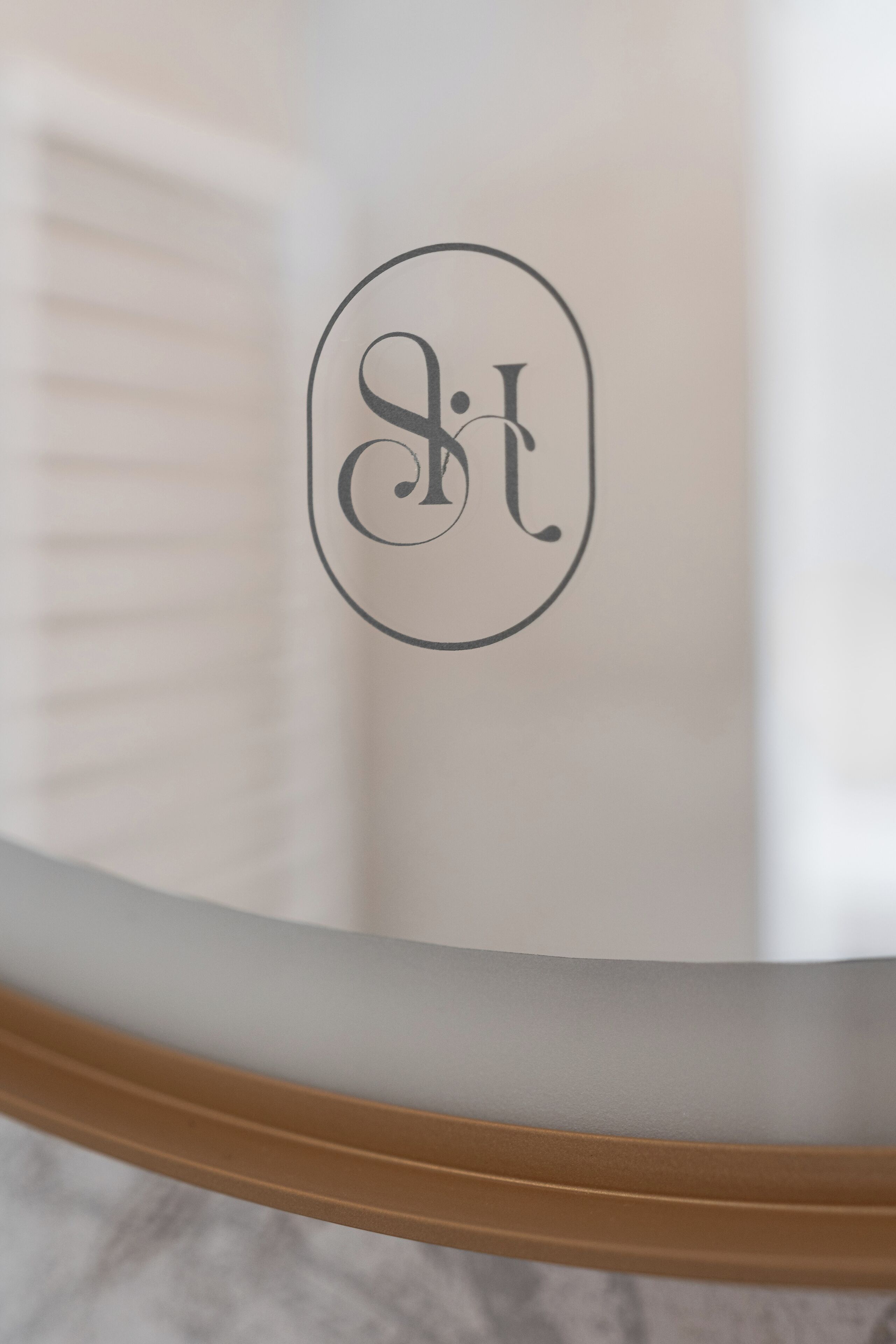 A close-up of a circular object with a logo or monogram.