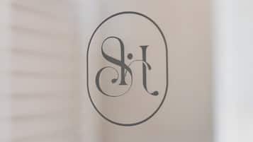 A close-up of a circular object with a logo or monogram.