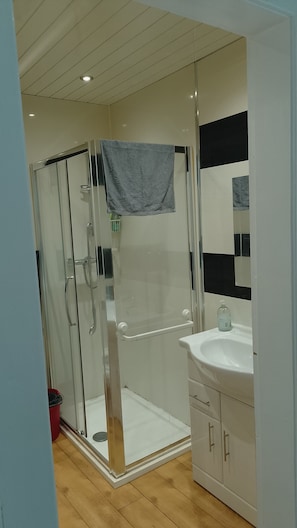 Shower, hair dryer, towels, soap