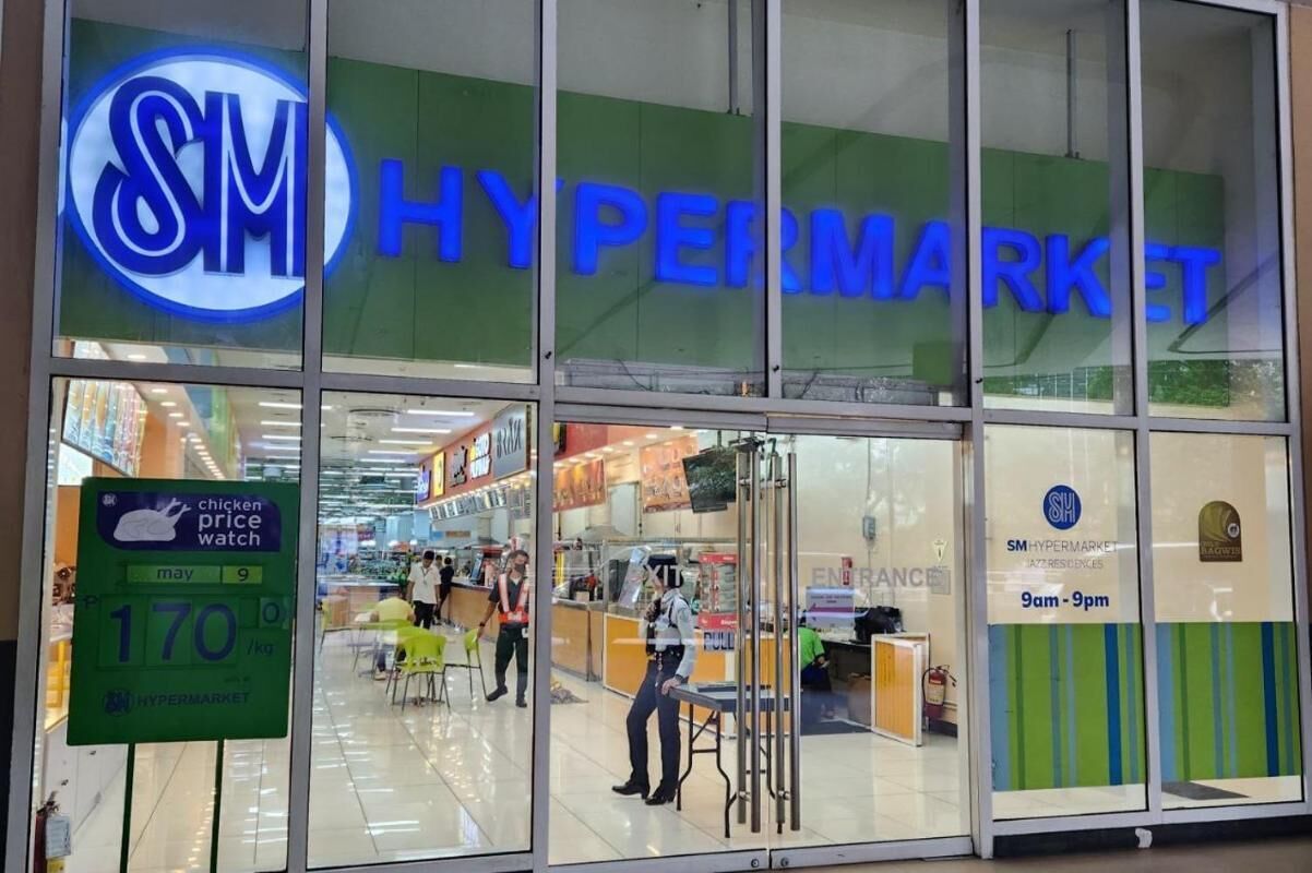 A Hypermarket with a visible entrance and a chicken price watch sign.