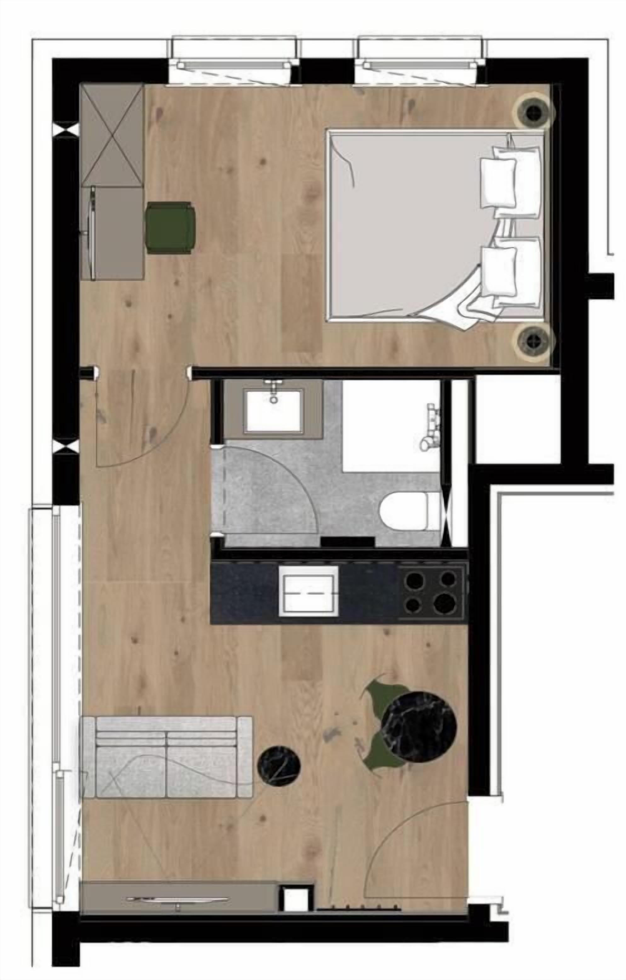 Plànol d'una habitació d'hotel amb cuineta, bany, zona de seients i una taula de menjador petita.