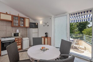 Family Apartment, 1 Bedroom (Peaceful Retreat With Terrace 2) | Living room | 32-inch Smart TV with digital channels