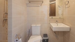 A modern bathroom with a toilet, bidet, and sink. - B2 China Town Yaowarat Premier (Bangkok)