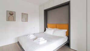 Apartment (1 Bedroom) | Laptop workspace, iron/ironing board, bed sheets