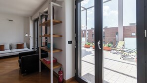 Apartment (2 Bedrooms) | Living area | 32-inch Smart TV with cable channels