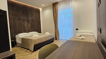 Hypo-allergenic bedding, pillowtop beds, desk, laptop workspace