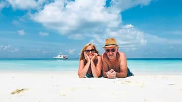 On the beach, white sand, free beach shuttle, beach towels