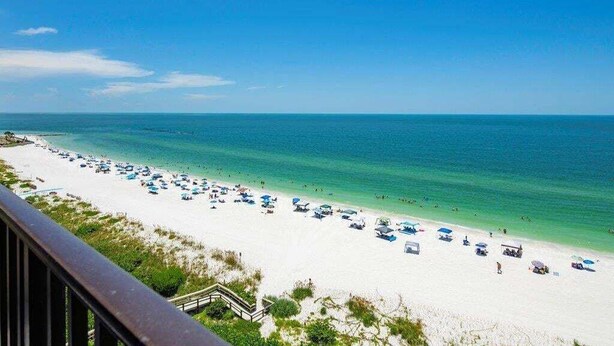 Beach - Beachfront 2BR condo in Marco Island with pool and WiFi. (Marco Island)