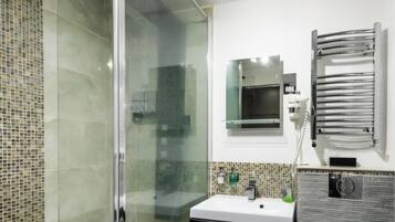 Shower, hair dryer, towels, soap