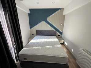 Deluxe Suite, Balcony | In-room safe, soundproofing, iron/ironing board, free WiFi