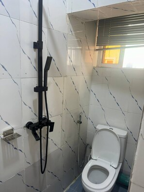 Shower, towels, soap, toilet paper