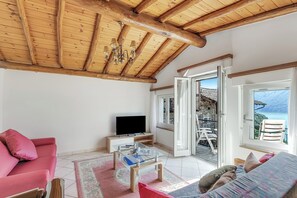 Standard Chalet, Multiple Bedrooms (Rustico la Staleta) | Living area | 21-inch flat-screen TV with cable channels, fireplace