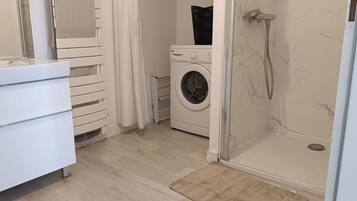 Shower, hair dryer, towels, soap