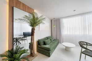Premium Apartment, Balcony, Pool View | Living area