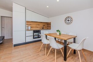 Standard Apartment, Balcony, Courtyard View | In-room dining