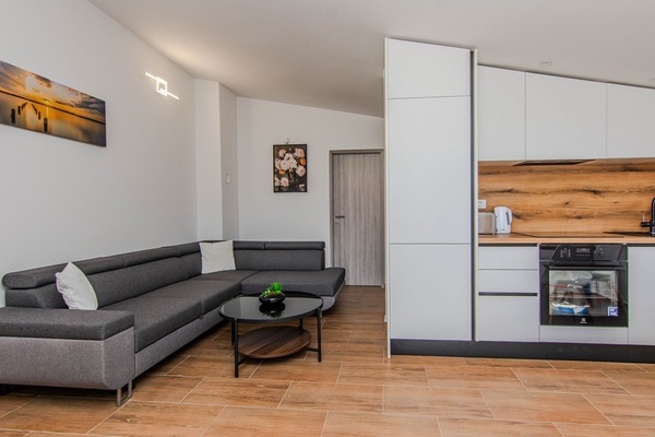 Standard Apartment, Balcony, Courtyard View | Living area | 100-cm Smart TV with satellite channels