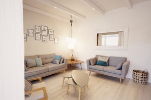 Suite Deluxe, patio, vue mer | Coin séjour