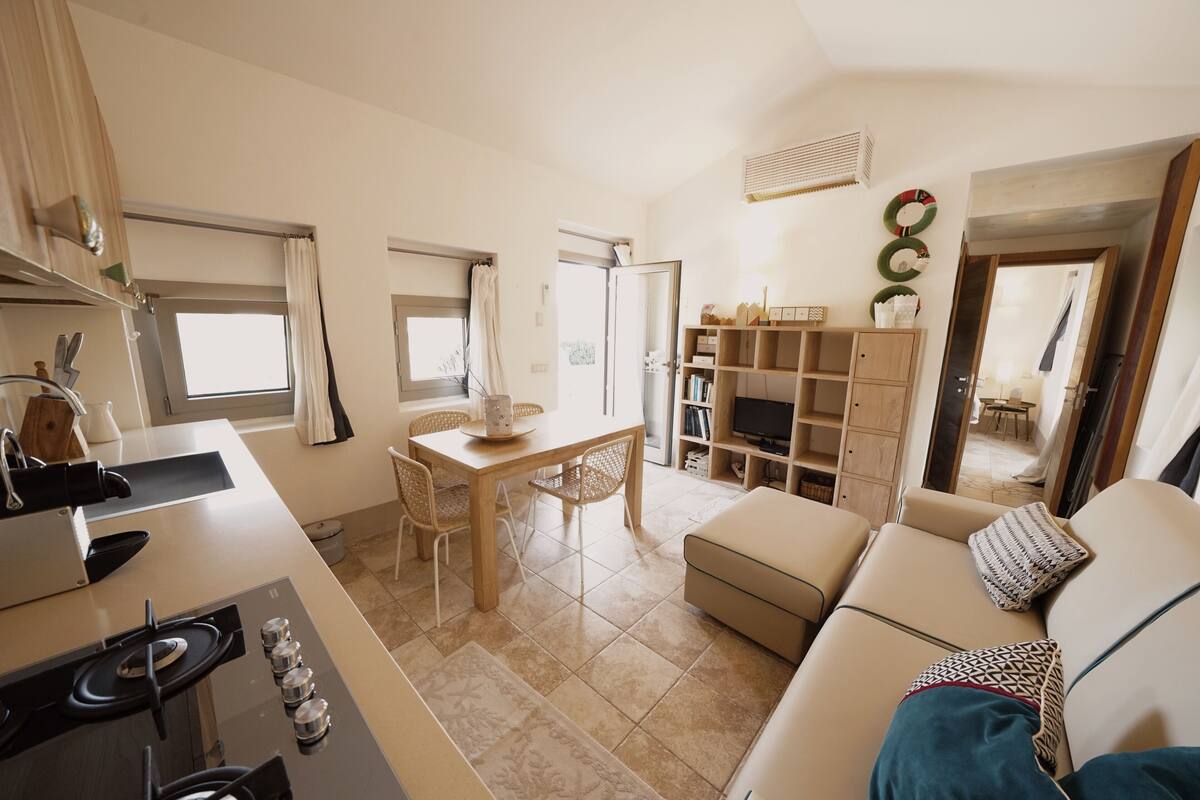 Deluxe House, 1 Queen Bed, Patio, Sea View | Living area | 40-inch flat-screen TV with digital channels