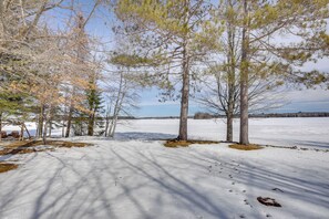 A snowy landscape with trees and a clear sky. - Solberg Lake House: Dock, Deck + Stunning Views! (Phillips)