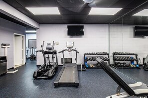 A gym with treadmills, a stationary bike, and dumbbells. - 3 BR, 3 BA Condominium in Myrtle Beach, Sleeps 6 (Myrtle Beach)