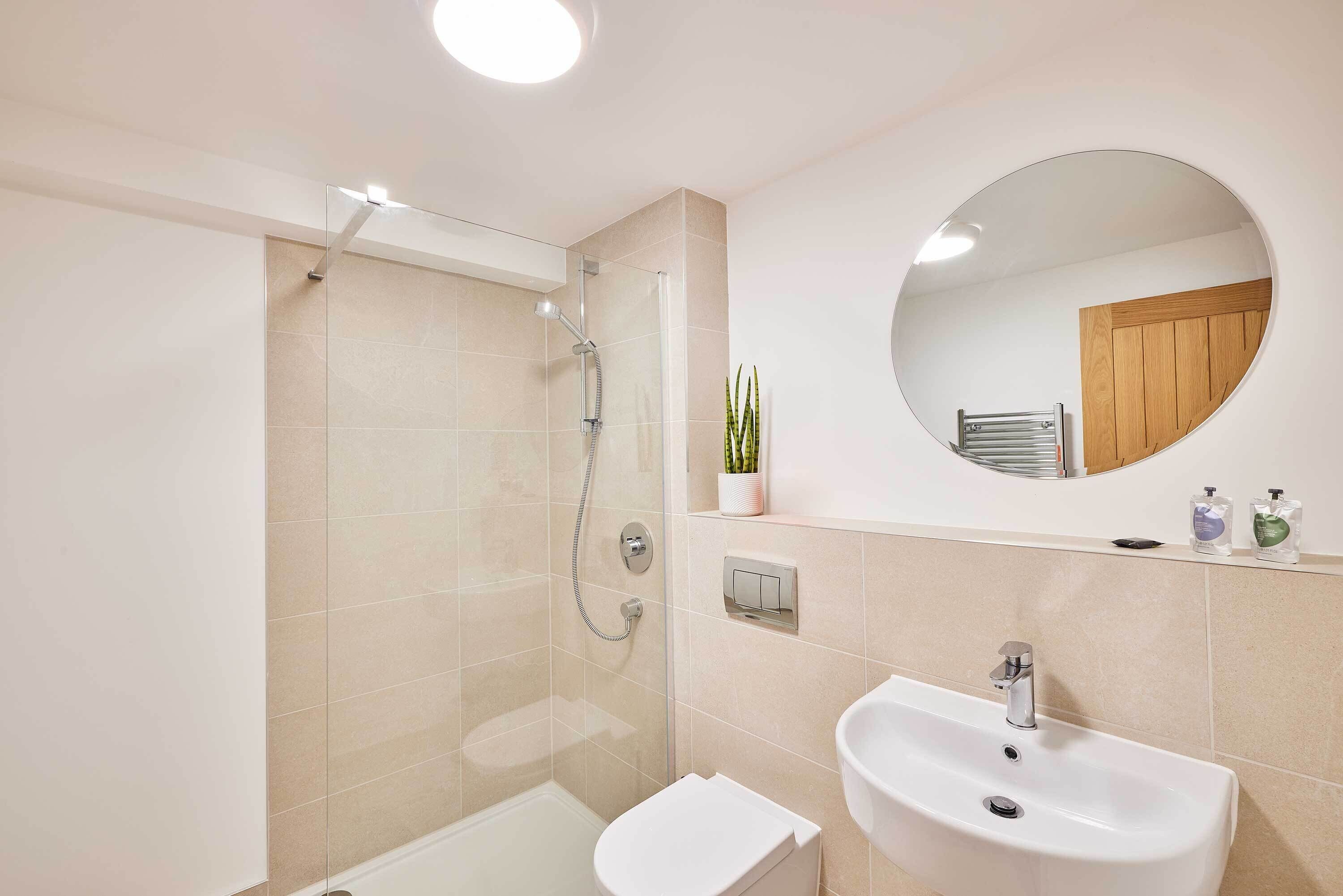 Shower, hair dryer, towels, shampoo