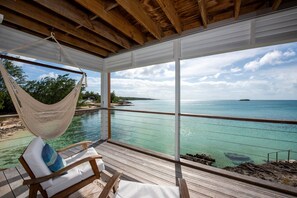 Terrace/patio - Touch Of Class Cottage - A Caribbean Beachfront Cottage 2 Bedroom Cottage (Savannah Sound)