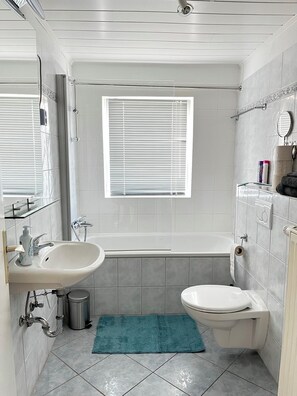 Hair dryer, towels, soap, toilet paper