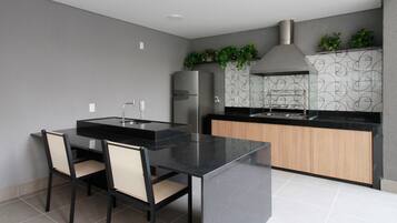 Fridge, microwave, coffee/tea maker, cookware/dishes/utensils