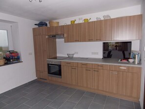 Fridge, stovetop, electric kettle, toaster