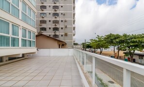 A multi-story building with a tiled balcony area. - 3BR apt Near Beach w/ Garage in Picarras Nra0490 (Picarras)
