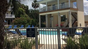 A pool area with a sign indicating no trespassing and a keep gate closed. - Sunsets, Canal Front, FISH, FISH, FISH!  Suwannee Cove - Unit 207, Boat Slip 23 (Suwannee)