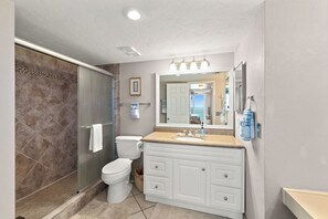 Shower, hair dryer, towels, soap