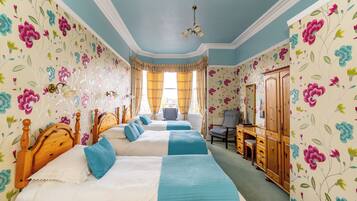 Deluxe Quadruple Room | Free minibar, individually decorated, individually furnished, desk